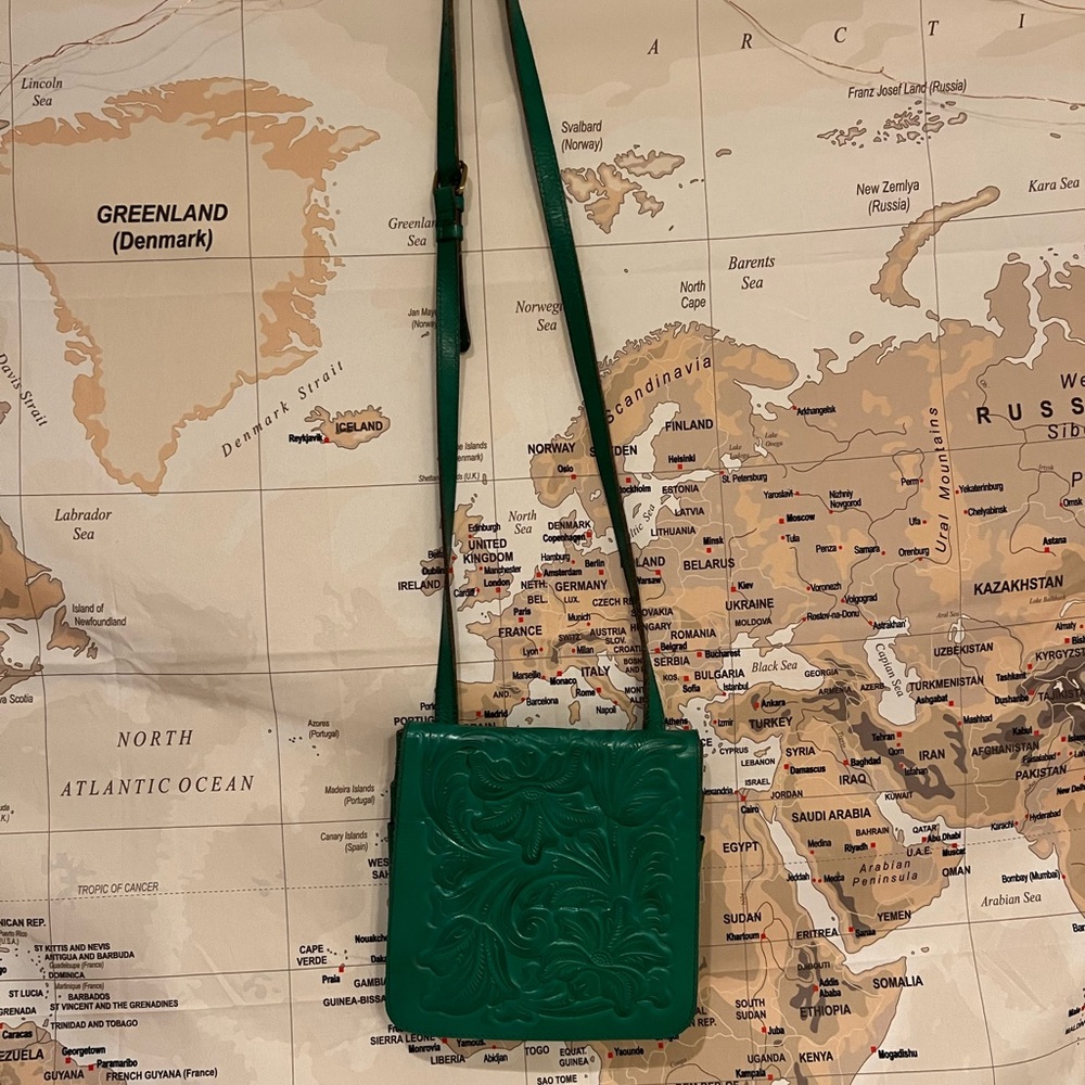 Patricia Nash green Granada 2 pocketed flip over crossbody bag.